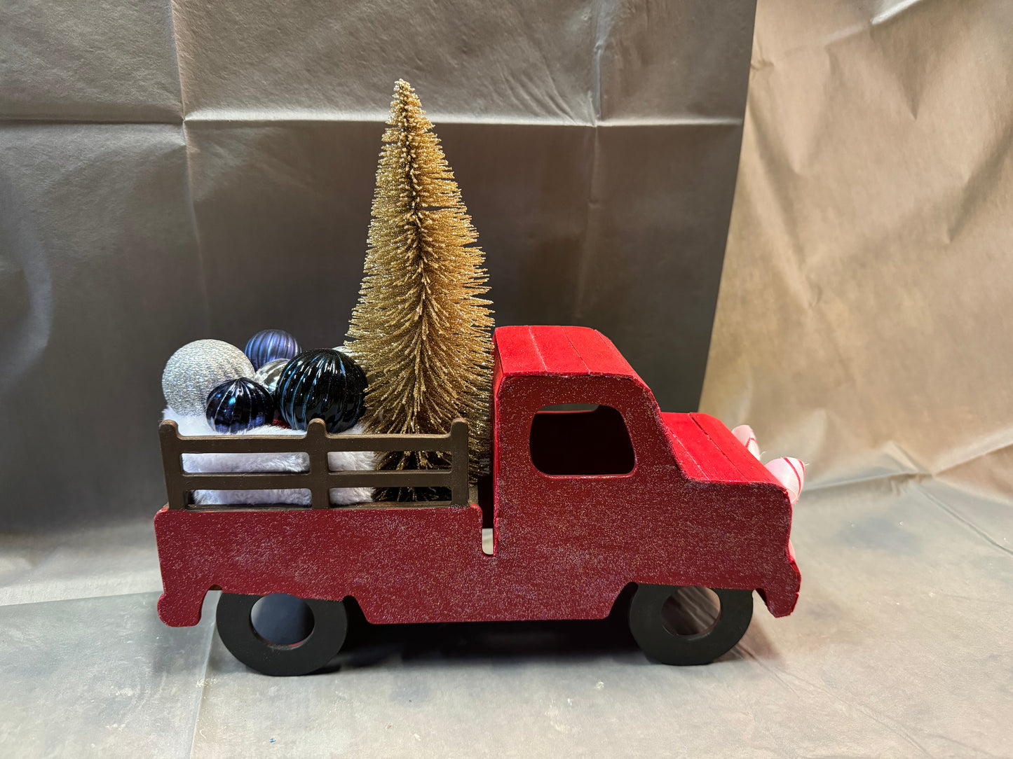 Little truck hauling a tree