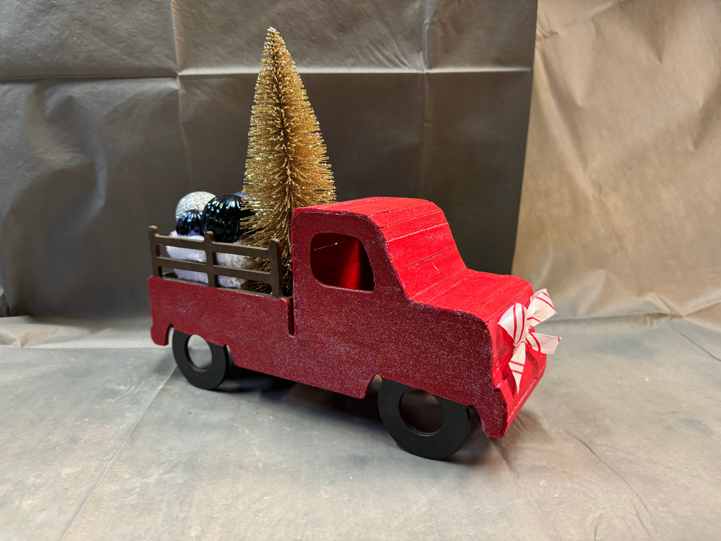 Little truck hauling a tree