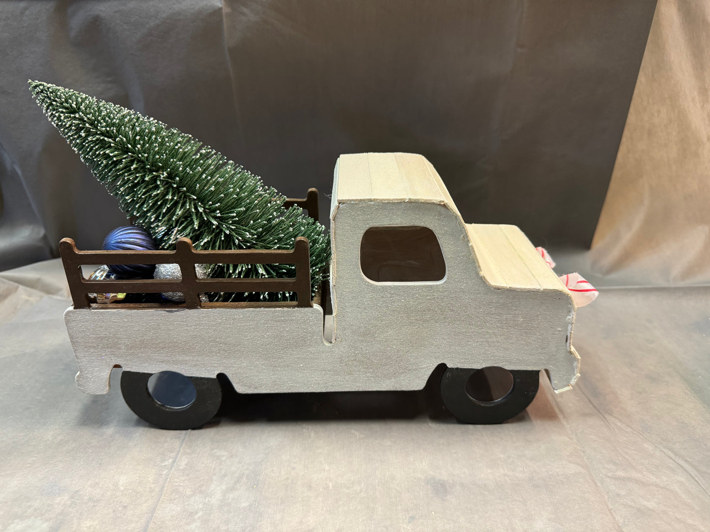 Little truck hauling a tree