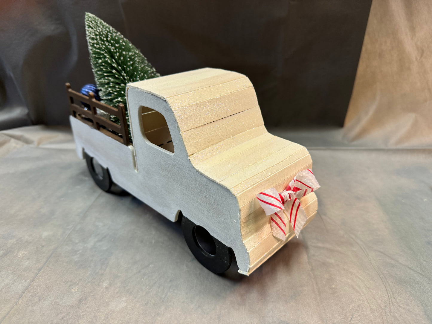 Little truck hauling a tree