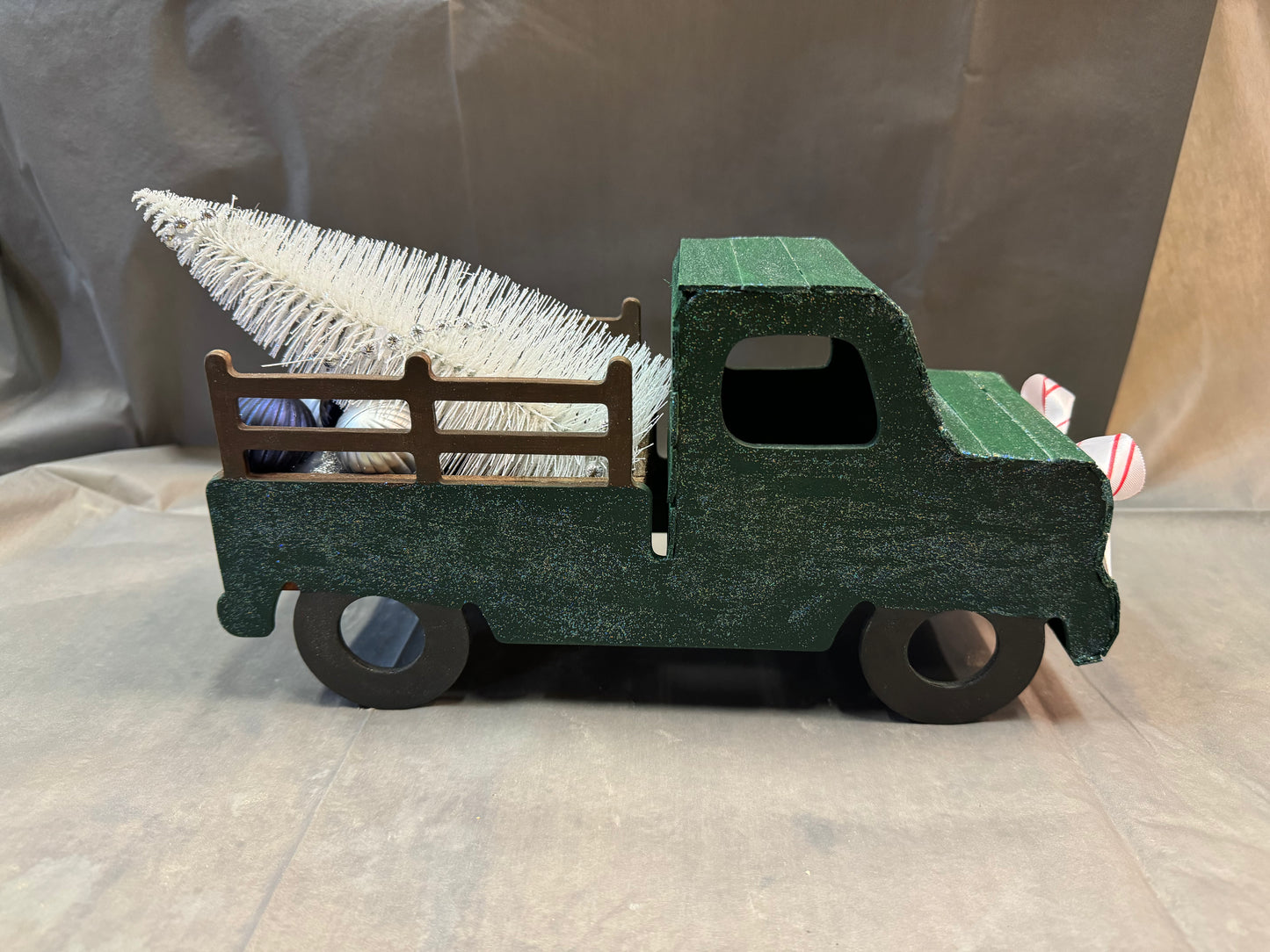 Little truck hauling a tree