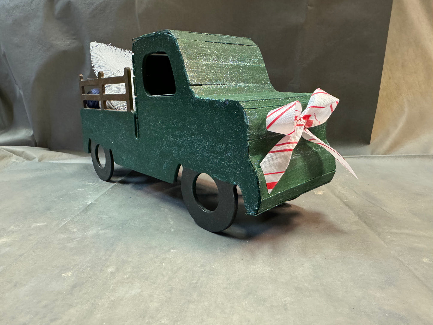 Little truck hauling a tree