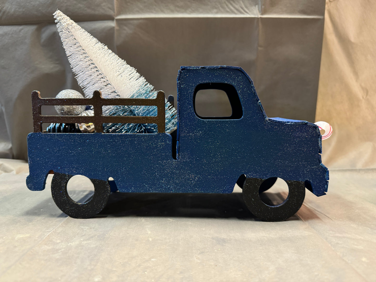 Little truck hauling a tree