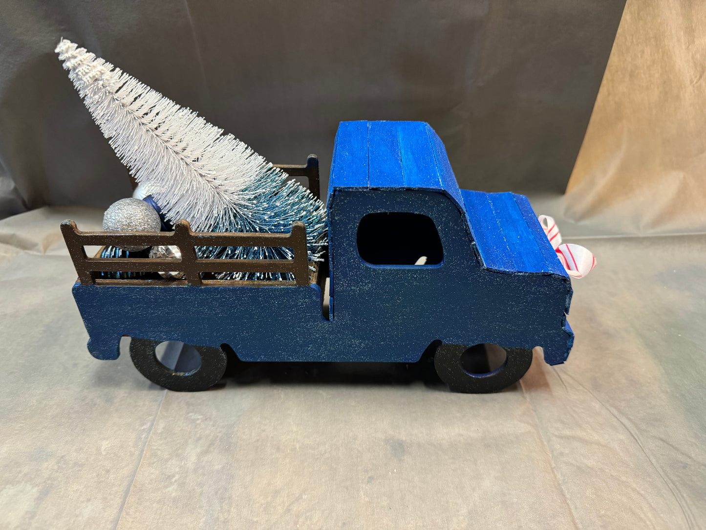Little truck hauling a tree