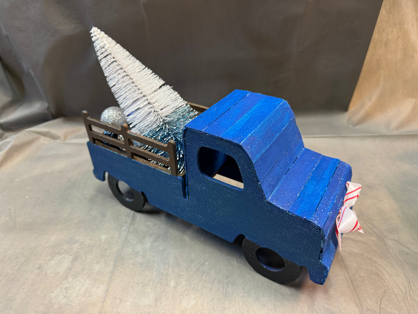 Little truck hauling a tree