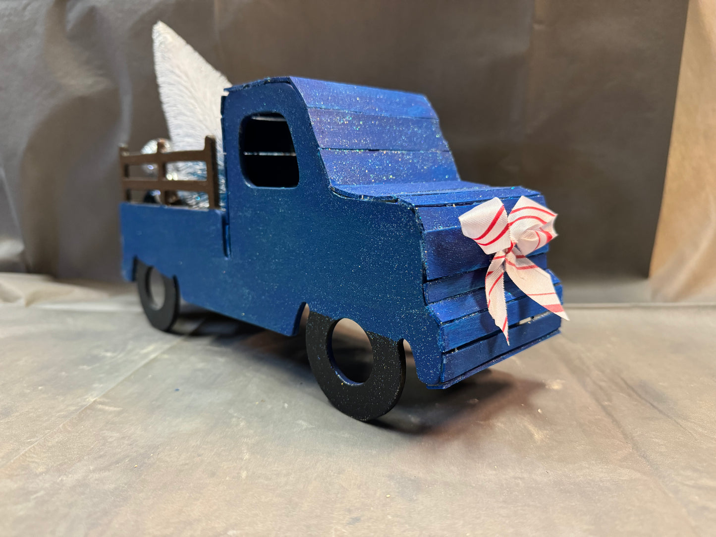 Little truck hauling a tree