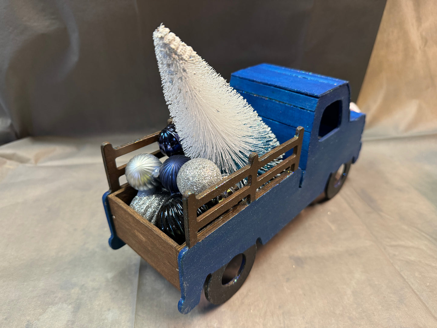 Little truck hauling a tree