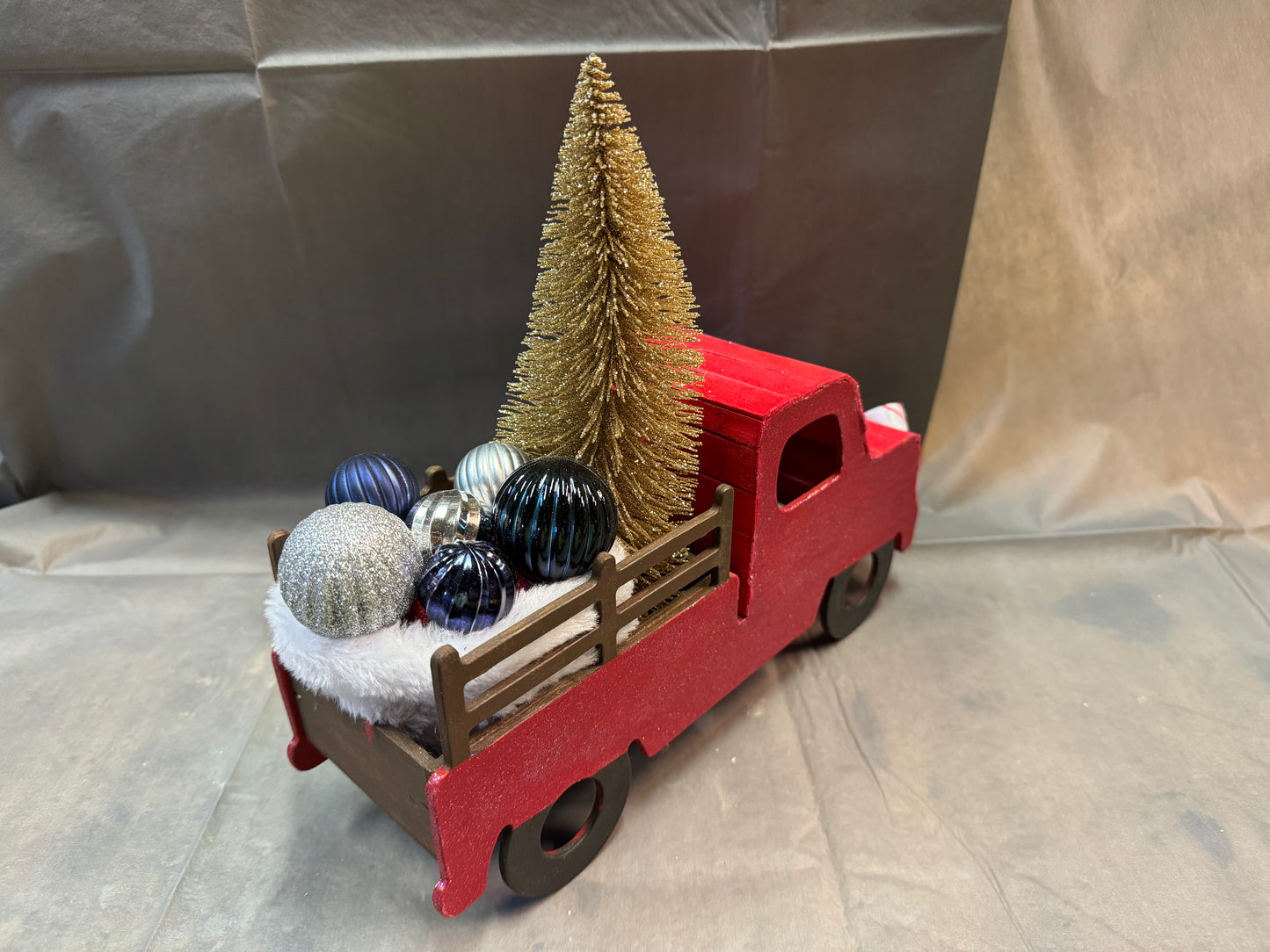 Little truck hauling a tree