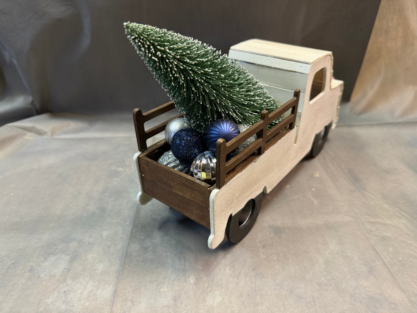 Little truck hauling a tree